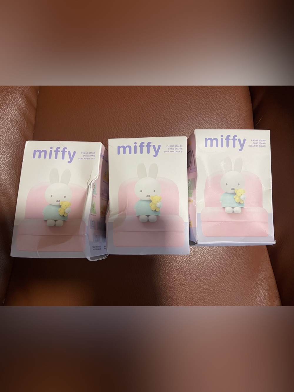 Three (3) unopened Blind boxes Miffy Sofa Phone Stands. Authentic Holograph seal